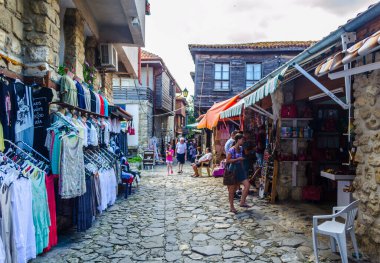 NESEBAR, BULGARIA, JULY 17, 2015: People are strolling during sunny summer day through streets of bulgarian city nesebar which belongs to the unesco world heritage.