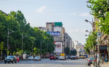 BUCHAREST, ROMANIA, JULY 11, 2015: Boulevard Ion C Bratianu leads down to the shopping district of Piata Unirii.