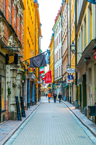 STOCKHOLM, SWEDEN, AUGUST 18, 2016: People are strolling on a street in the Gamla Stan district in central Stockholm, Sweden.