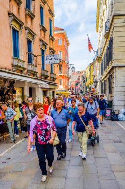 VENICE, ITALY, SEPTEMBER 20, 2015: crowds of tourists are passing through busy rio tera lista di spagna street connecting santa lucia train station with northern part of the city