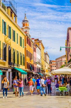 VENICE, ITALY, SEPTEMBER 20, 2015: people are strolling over strada nuova street in italian city venice, which belongs to the main streets of the city.