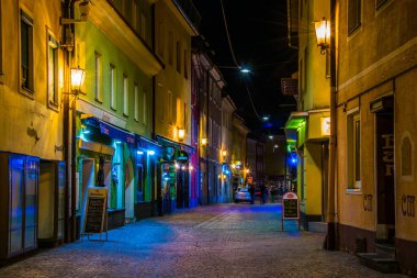 VILLACH, AUSTRIA, FEBRUARY 20, 2016: view of a narrow street full of bars and restaurants which is center of nightlife of the austrian city villach