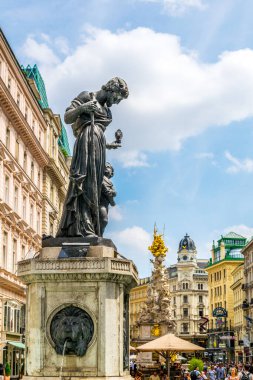 VIENNA, AUSTRIA, JUNE 2016: View of the memorial Plague column (Pestsaule) and tourists on Graben street Vienna.