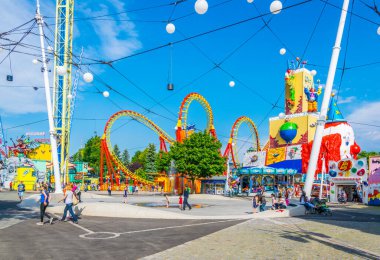 VIENNA, AUSTRIA, JUNE 2016: View of an orange roller coaster situated inside of the prater amusement park in Vienna, Austria.