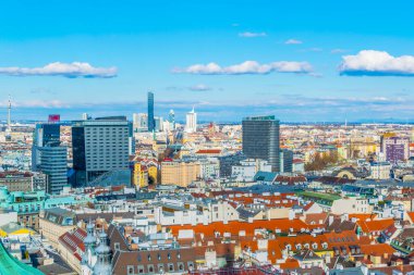 VIENNA, AUSTRIA, FEBRUARY, 2016: Aerial view of Vienna with Donauturm, prater and its riesenrad ferris wheel from top of the stephansdom cathedral.