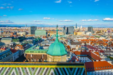 VIENNA, AUSTRIA, FEBRUARY, 2016: Aerial view of Vienna with Donauturm, prater and its riesenrad ferris wheel from top of the stephansdom cathedral.
