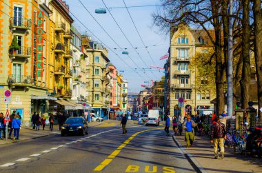 ZURICH, SWITZERLAND, OCTOBER 24, 2015: People are strolling through a narrow street in suburbs of the biggest swiss city zurich.