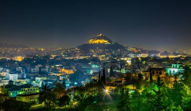 Night aerial view of lycabetus hill and its neighborhood in athens