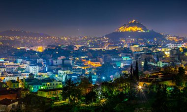 Night aerial view of lycabetus hill and its neighborhood in athens