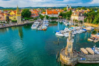 Aerial view of the german port Lindau including Mangturm tower and a lion statue