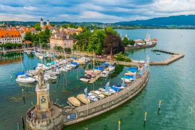 Aerial view of the german port Lindau including Mangturm tower and a lion statue