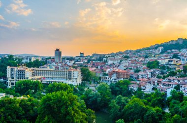 Sunset over traditional houses in the old town of Veliko Tarnovo, Bulgari