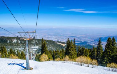 Vitosha mountain is situated juse next to the bulgarian capital sofia and every winter it becomes famous ski center and many skiers use a lift in order to ski - snowboard just minutes away from town.