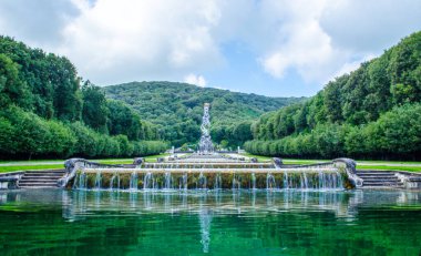 2 kilometers long promenade leading through gardens of imperial palace in caserta is decorated by many fountains and statues from bernini and ends by artificial waterfall.