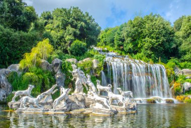 2 kilometers long promenade leading through gardens of imperial palace in caserta is decorated by many fountains and statues from bernini and ends by artificial waterfall.