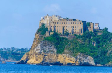 italain island procida is famous for its colorful houses and ancient fortress overlooking whole bay of naples.