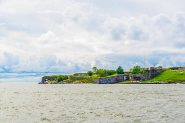 Suomenlinna archipelago used to serve as a military base and now is enlisted on the unesco world heritage list. view from a ferry near Helsinki, Finland