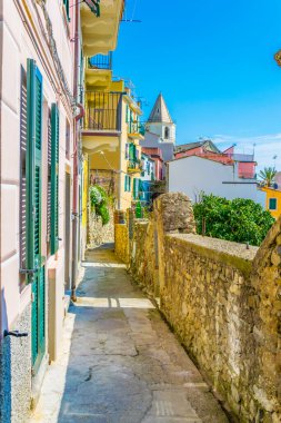 view of a narrow street waiting for tourists to come in corniglia, cinque terre, italy.