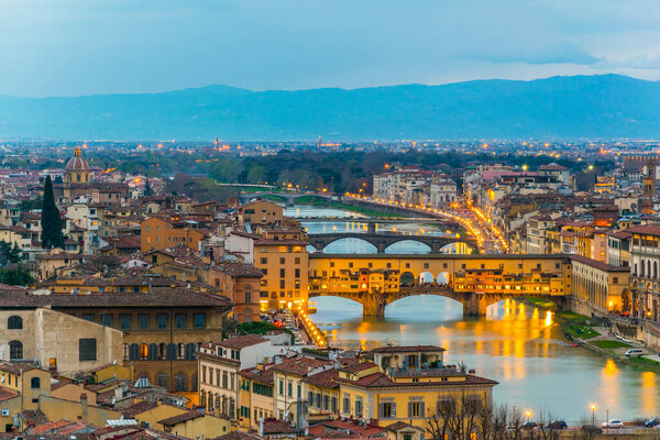 Aerial view of the Ponte vecchio in the italian city florence during sunset