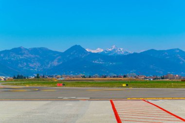bergamo airport is situated just under the bergamo city and the alps