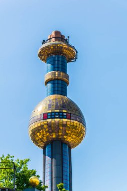 View of the famous waste incinerator designed by friedensreich hundertwasser in spittelau, wien.