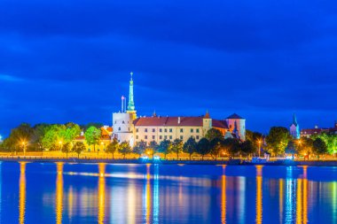 Sunset view of the Riga castle from the other side of the Daugava river, Latvia