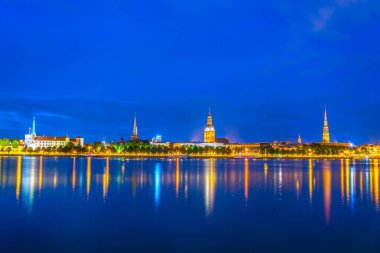 Panorama of riga including the Riga castle, cathedral, Saint Peter and Saint James churches taken during sunset, Latvia.