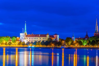 Sunset view of the Riga castle from the other side of the Daugava river, Latvia