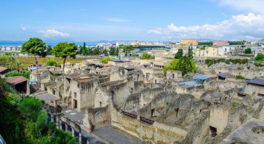 ruins of herculaneum destroyed by vesuvius volcano are less famous than ruins of pompeii, but nevertheless they also create compact area of former buildings attracting thousands of tourist every year clipart