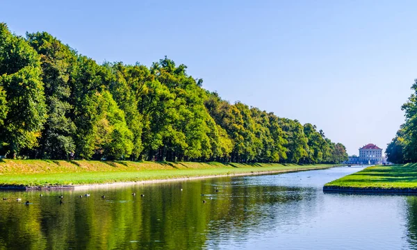 View of a lake situated inside of the nymphenburg palace complex in german city munich