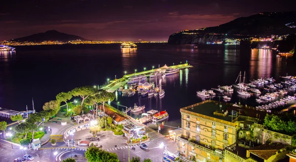 Night scene of Sorrento, the pier with lots of yachts, a corner of the cityscape on a summer night, Amalfi coast, Italy