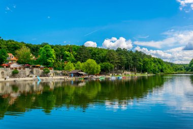 view of an open pool reflecting during a sunny day in Sopron, Hungary