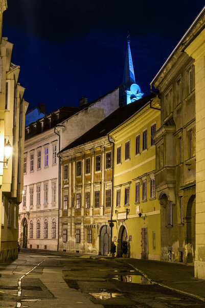 Narrow street in the old town of Sopron during night, Hungary