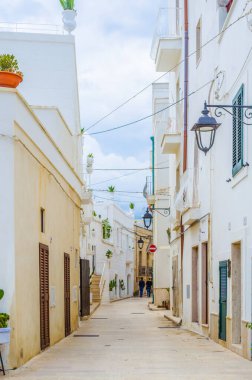 View of a narrow street in the Italian city Polignano a Mar