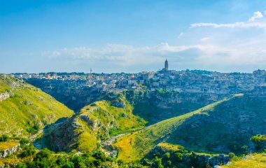 Italian city matera surrounded by pristine nature full of hill and valleys beneath the