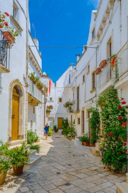 View of a white narrow street in the Italian city Locorotond