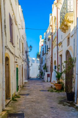 View of a white narrow street in the Italian city Ostun