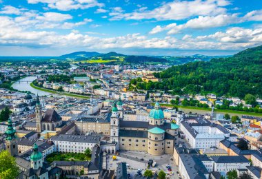 Aerial panoramic view of the historic city of Salzburg including Mirabell palace, the Salzburg cathedral and many churches