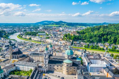 Aerial panoramic view of the historic city of Salzburg including Mirabell palace, the Salzburg cathedral and many churches
