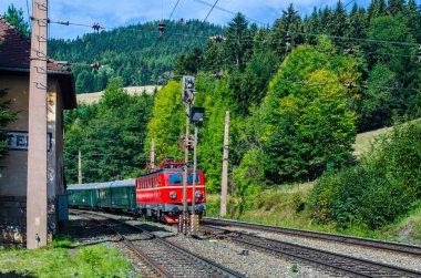 a train is coming into the breitenstein am semmering train station which is part of the famous semmeringbahn in austria, part of the unesco world heritage