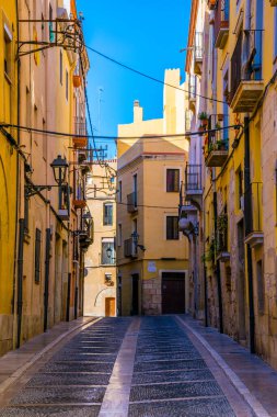 view of a colorful narrow street in the historical center of spanish city tarragona