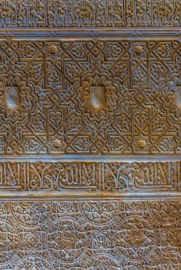 detail of a beautiful decoration of the alhambra palace in spain.