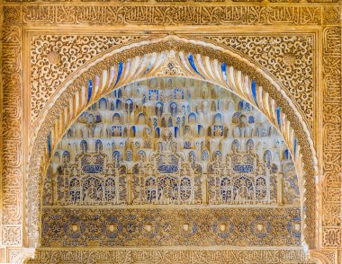 detail of a beautiful decoration of the alhambra palace in spain.