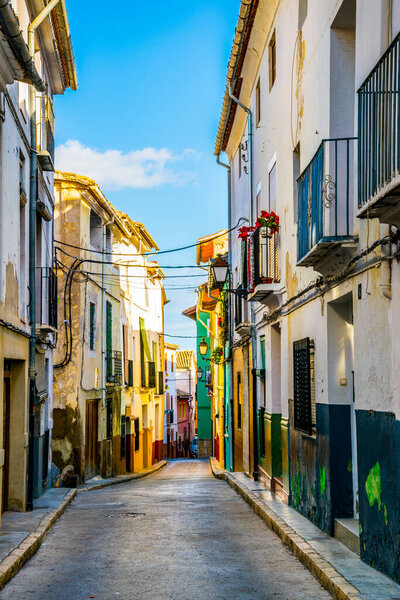 Colourful narrow street in xativa town near valencia, which is famous for its castle