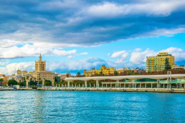 paseo del muelle dos promenade in spanish city malaga which stretches through port under a construction resembling white wave