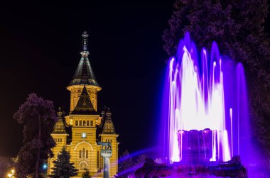 fountain in the middle of victory square - piata victoriei - in romanian timisoara is a popular meeting spot for locals especially after sunset when nightlife begins.