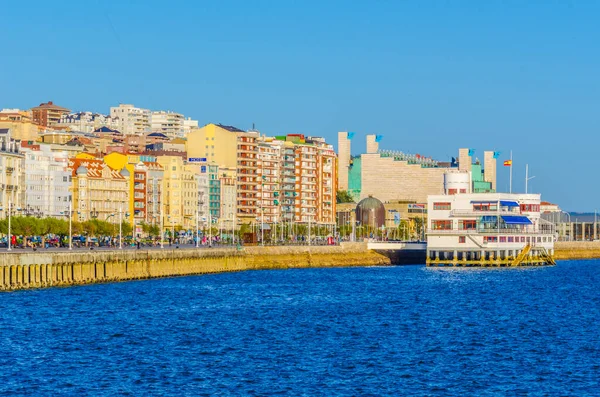 People are strolling on promenade in Santander, Spai
