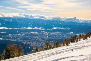 View of dolomites alps covered with snow from the gerlitzen mountain near villach.