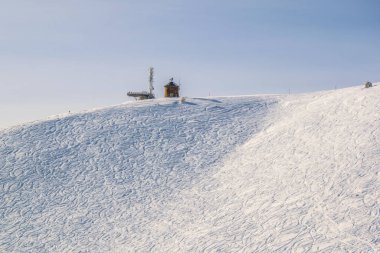 view of ski trails carved into slope of the gerlitzen mountain near villach, austria.