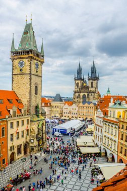 PRAGUE, CZECH REPUBLIC, APRIL 25, 2015: People are waiting for astrological clock performance on the old town square in prague. Tyn cathedral in on background